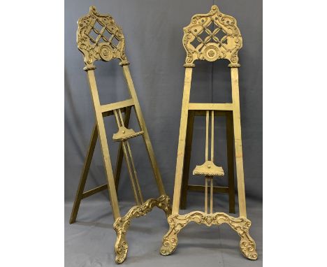 TWO LARGE VINTAGE GILT DECORATED EASEL STANDS having lattice work and applied mouldings with adjustable tray support, 172cms 