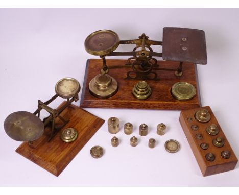 TWO SETS OF SMALL POSTAL SCALES WITH WEIGHTS, 20cms the widest