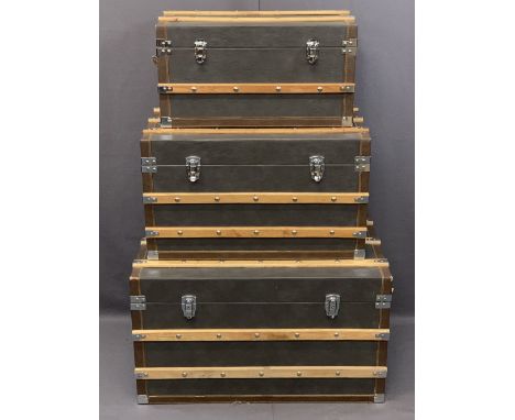 MODERN SET OF THREE VINTAGE STYLE STEAMER TRUNKS, leather effect with wooden banding, 46cms H, 81cms W, 51cms D the largest