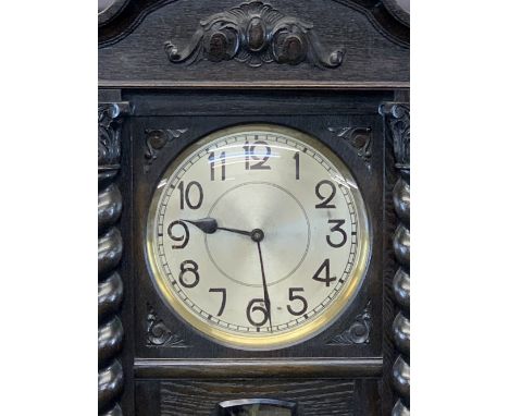 CIRCA 1930 CARVED OAK LONGCASE CLOCK with barley twist Corinthian cap front detail, chime strike three weight chain and pendu