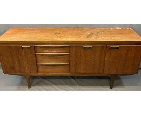 GREAVES &amp; THOMAS MID-CENTURY LONG TEAK SIDEBOARD, dark oak Priory style gate leg table and three wheelback dining chairs,