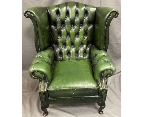 ANTIQUE STYLE GREEN LEATHER EFFECT BUTTON UPHOLSTERED WINGBACK ARMCHAIR, 103cms H, 90cms max W, 50cms seat depth