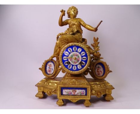 FRENCH MANTEL CLOCK gilt metal with painted enamel dial and porcelain plaques, 32cms H, 26cms W, 10cms D 