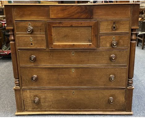 19TH CENTURY OAK CHEST OF 8 DRAWERS, the moulded edge top over a secret central frieze drawer, deep centre drawer with flanki