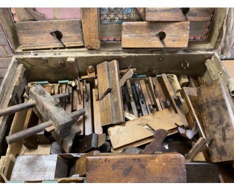 CARPENTER'S TOOLS - MOULDING PLANES a very large quantity in a vintage trunk ETC