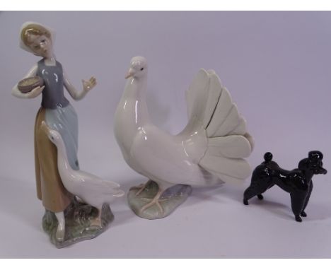 LLADRO DOVE, 20cms tall and a figure of a young girl feeding geese, 24cms tall, also a black Beswick poodle