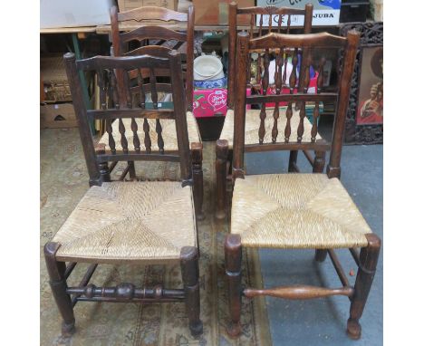 Four various 19th century rush seated ladder back chairs, all on stretchered supports 