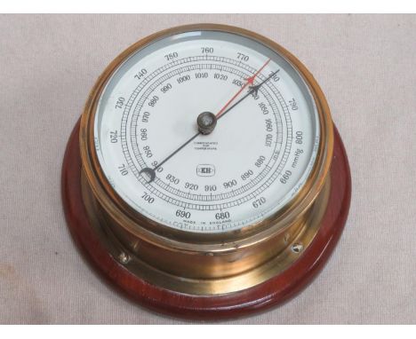 Vintage brass and glass circular wall mounting barometer, stamped KH to face, Approx. 19cms diameter 