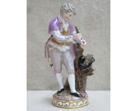 19th century Meissen hand painted and gilded ceramic figure depicting a young gent collecting kindling, stamped with blue cro