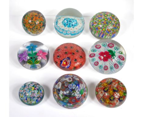 Nine vintage glass paperweights