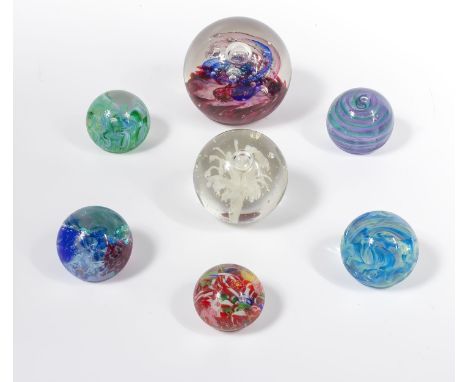 Seven vintage glass paperweights