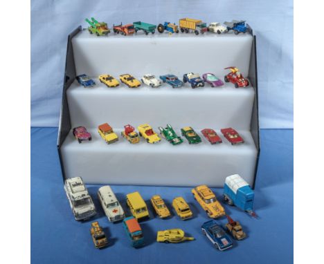 A collection of vintage Corgi, Dinky and other play worn die cast vehicles
