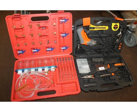 A CASED TOOL KIT, ETC 