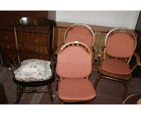 AN ERCOL STYLE ROCKING CHAIR TOGETHER WITH THREE WHEEL BACK CHAIRS 