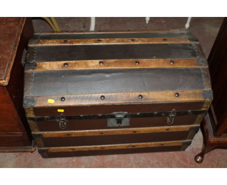 A DOME SHAPED PACKING TRUNK 