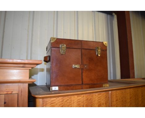 A leather and brass mounted picnic hamper 