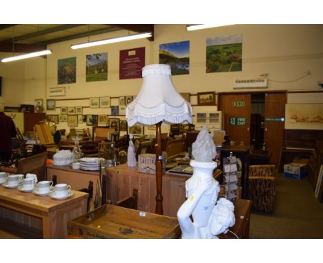 A mahogany standard lamp and shade 