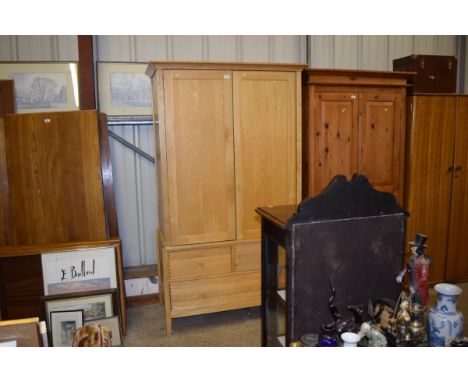 A Willis &amp; Gambia light oak double wardrobe fitted two short over a single long drawer below