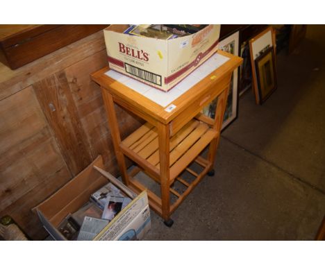 A pine tile topped kitchen trolley 