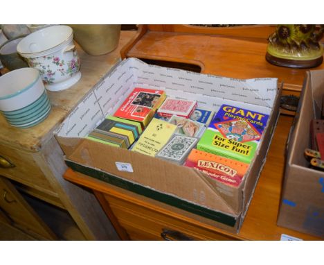 A box of various playing cards 