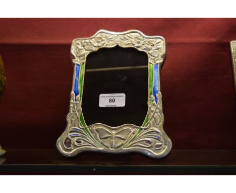 A white metal and enamel decorated photo frame 
