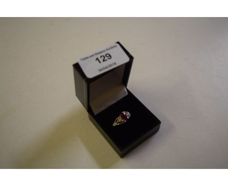 A silver and ruby set ring 