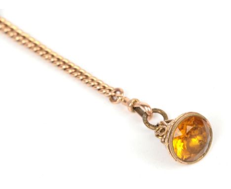 A graduated half Albert chain each link stamped '9' '.375', with a 9 carat gold T-bar and a yellow paste set fob .  Chain and