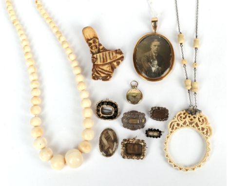 Seven mourning brooches, in varying states of repair; a locket; a netsuke; a magnifying glass necklace (glass deficient); and