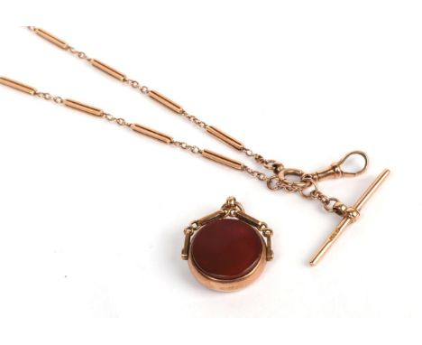 An Albert chain with applied plaque stamped '9CT'; and a 9 carat gold seal fob .  Chain - 9.01 grams. Fob - 6.08 grams. 