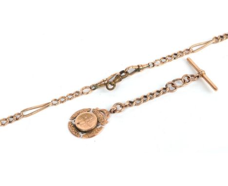 A figaro link Albert chain each link stamped '3' '.375' (a.f.), with a 9 carat gold T-bar and a 9 carat gold shield .  Gross 