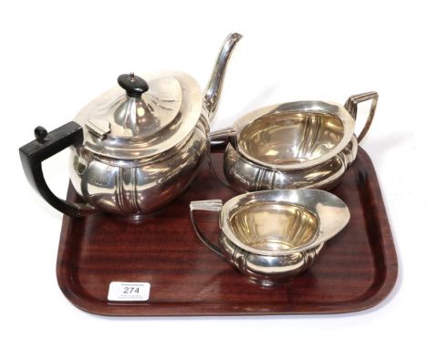 A three piece silver tea service, J &amp; W Deakin, Sheffield 1911/12, the teapot 28cm long, 36.7ozt (3)