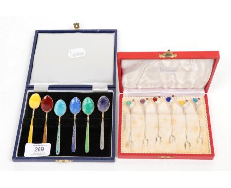 A set of six silver gilt and enamel coffee-spoons, Birmingham 1979, enamelled in differing colours, in fitted case; and a set