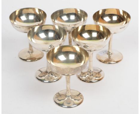 A set of six silver champagne saucers, Walker &amp; Hall, Sheffield 1913, 10.5cm high, 19.9ozt (6)