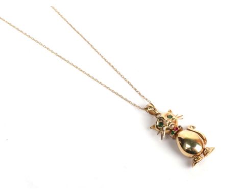 A 9 carat gold articulated gemset cat pendant on a trace link chain with clasp stamped '375', pendant length 3.9cm.  Gross we