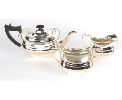 Three piece silver tea service by Jackson &amp; Fullerton, London 1909, retailed by Mackay and Chisholm, Edinburgh, the teapo