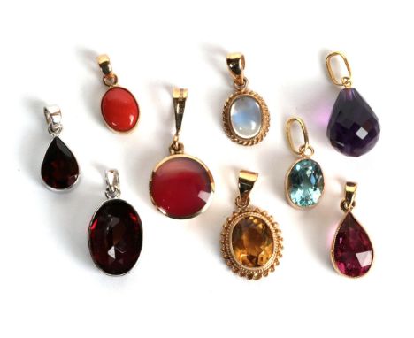 A 9 carat gold checkerboard tourmaline pendant; a 9 carat gold blue topaz pendant; two 9 carat white gold garnet pendants; a 