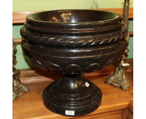 ^ A carved black marble planter, 45cm diameter 