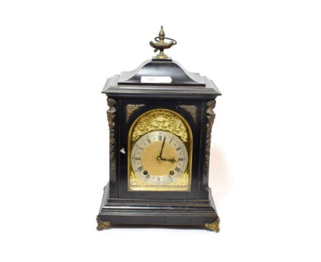 A Victorian quarter striking ebonised table clock, movement back plate stamped W&amp;H, quarter striking on two gongs 
