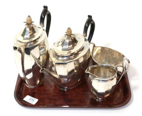 A four piece silver tea service, Roberts &amp; Belk, Sheffield 1925, of panelled oval form, the covers with pineapple finials