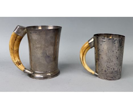 TWO SILVER TANKARDS WITH WARTHOG TUSK HANDLESLargest 13cm HTotal weight: 815gms