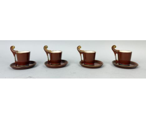 A SET OF FOUR 1930S FRENCH ULZSCHNEIDER AND CO, EGYPTIAN REVIVAL COFFEE CUPS FROM SARREGUEMINES