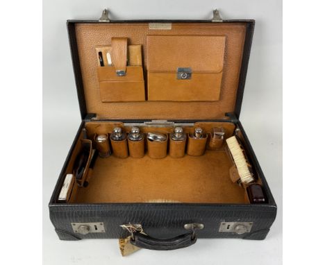 A GENTLEMAN'S TRAVELLING VANITY CASE WITH SILVER PLATED TOP BOTTLES56cm x 35cm