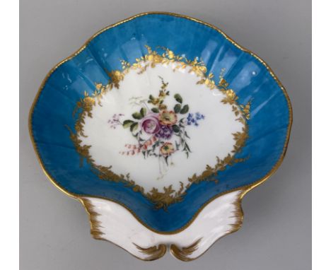A VINCENNES PORCELAIN CLAM SHAPED DISHBlue ground with central painted floral spray and gilt detailing.25cm W