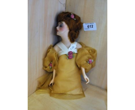 VINTAGE HALF DOLL LADY WITH WIG DRESSED IN GOLD WITH FLOWERS WITH PORCELAIN ARMS/HANDS