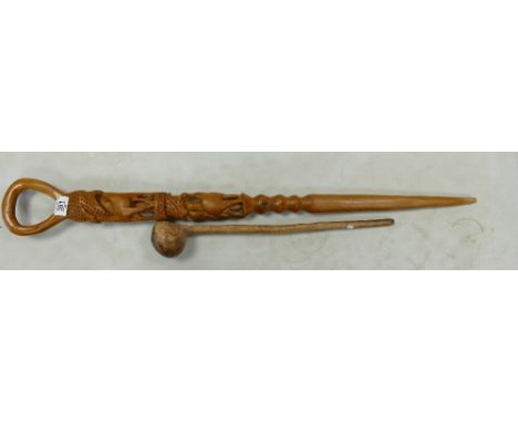 A carved tribal stick: together with a knob kerrie . height of tallest 97cm 