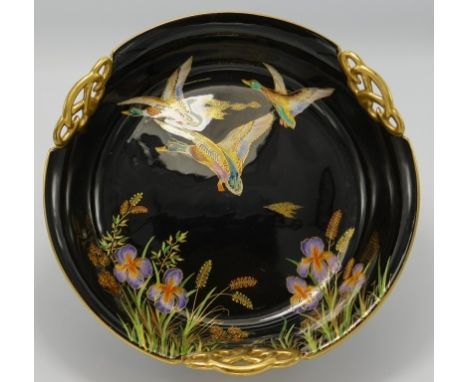 Carltonware fruit bowl decorated with enamelled flying mallard ducks: On black ground, diameter 25cm. 