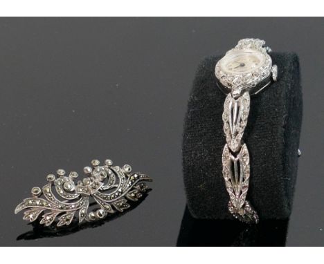 Lauris Ladies vintage nmarcasite cocktail watch: model sprite together with a similar marcasite brooch. (2) 