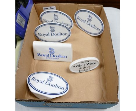 A collection of Royal Doulton Arthur Woods Ceramic Counter Top Advertising Name Plaques(6) 