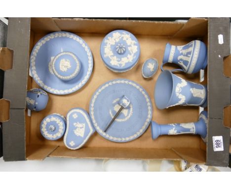 A collection of Wedgwood Jasperware to include: lidded Boxes, Jugs, Candlestick, Vase, Pipe etc 