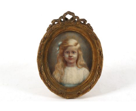 A Continental late 19th Century portrait miniature on ivory of a young pretty girl with blonde curly hair, wearing a white dr